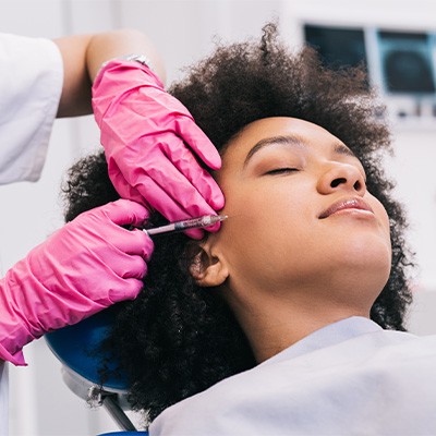 Patient getting BOTOX injections for facial pain, migraines, or bruxism