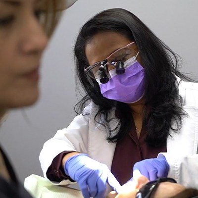 Dentist performing dental exam