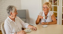 Ladies converse over coffee