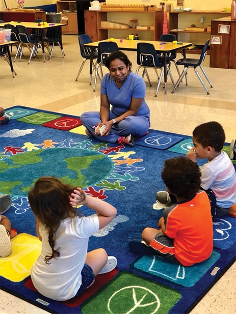 Dr Parmar teaching kids about oral health