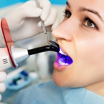 Patient receiving dental bonding treatment