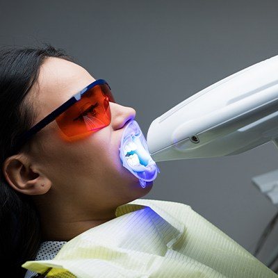 Patient receiving in office teeth whitening