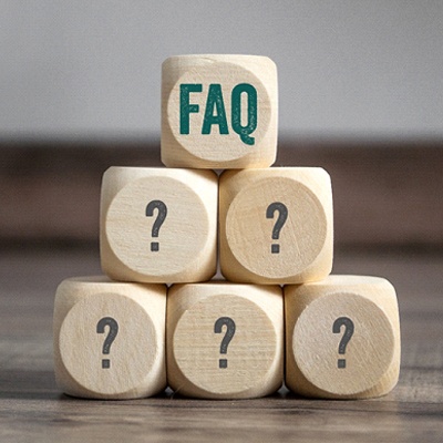 Pyramid of small wooden blocks with question marks