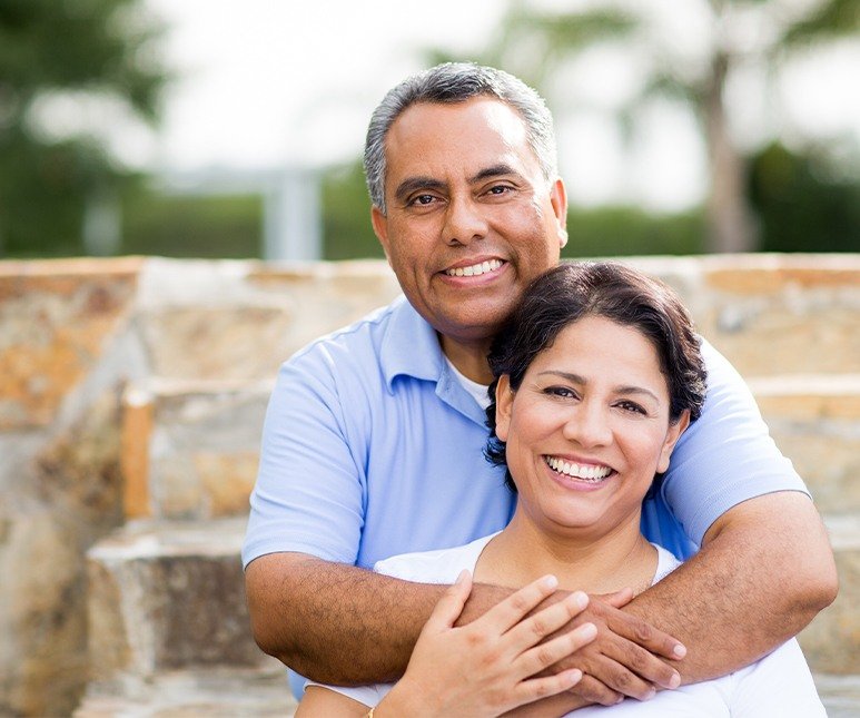 Smiling older man and woman outdoors