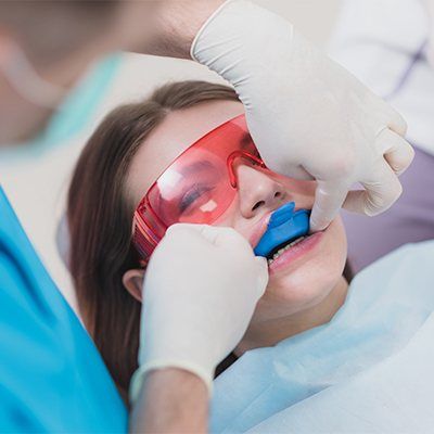 Child receiving fluoride treatment