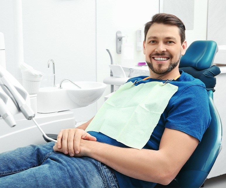 Smiling man in dental chair