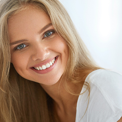 patient smiling after getting veneers in McKinney 