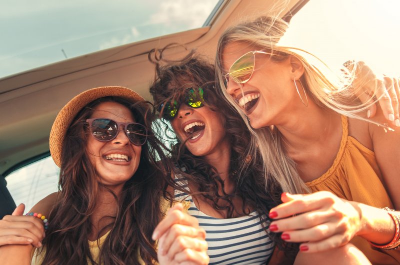 women laughing during summer in Frisco