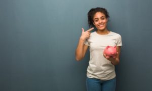 patient pointing towards her smile in Frisco