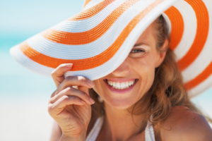 a patient showing off her smile during the summer