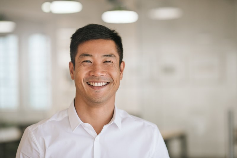 man with dental implants smiling