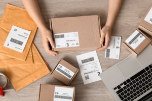 Close up of someone preparing to send out packages